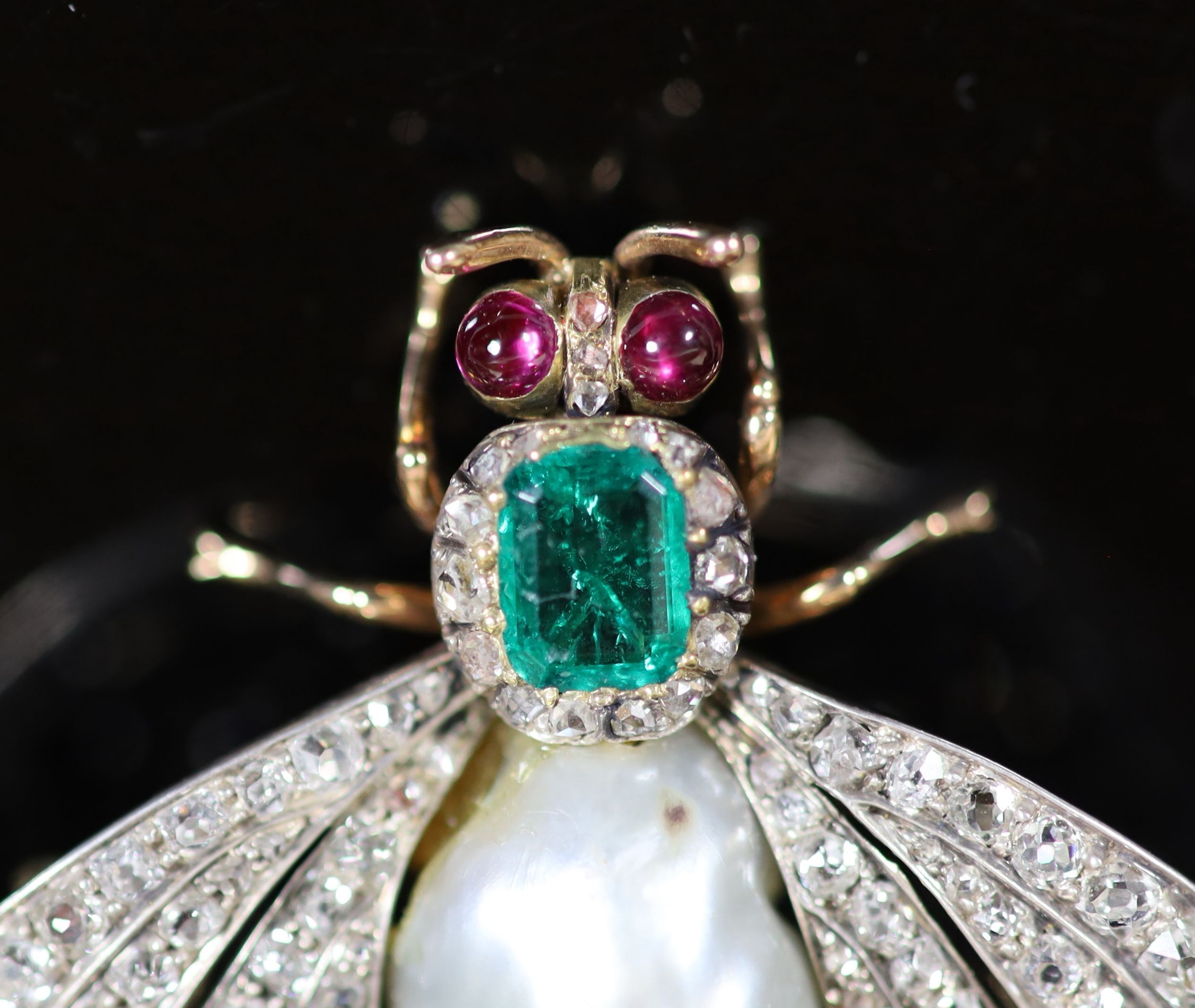 A cased late Victorian gold, baroque pearl, emerald ruby and graduated old mine cut diamond set bee brooch